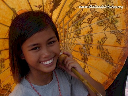 A Thai girl holding an umbrella