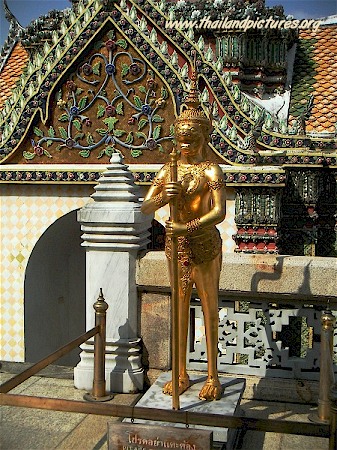 A golden guard located at the Royal Grand Palace in Bangkok, Thailand.